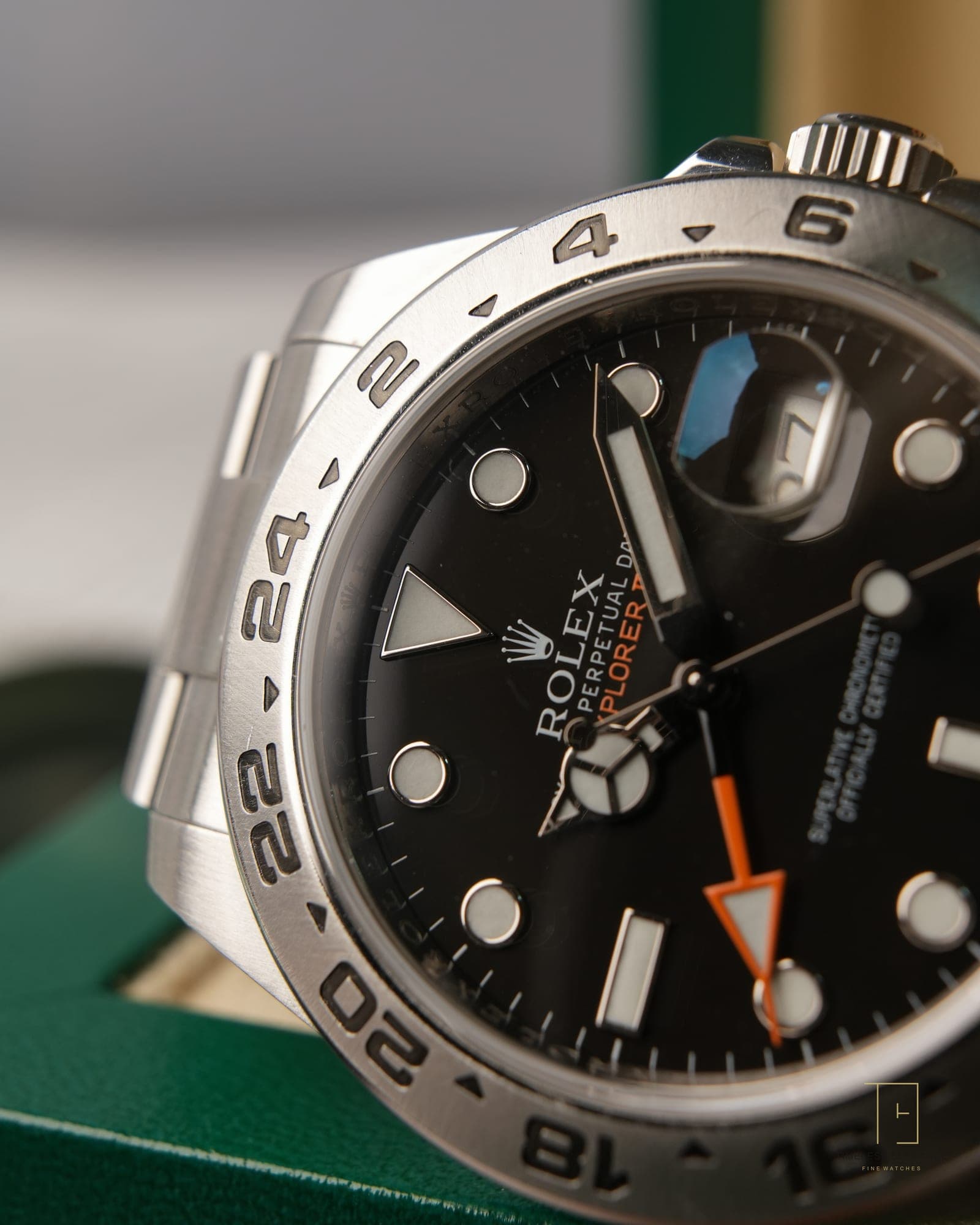 Macro detail of a Rolex Explorer II, black dial with its orange twenty-four hour hand
